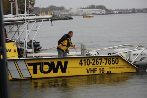 This tow boat, used to facilitate stretching the 1,700-foot rope acrosss Spa Creek, was a tug boat on Saturday.